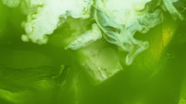 Macro Pour of Milk Into Iced Matcha Latte , Super Slow Motion , Macro Shot