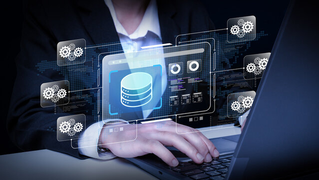 Database Management System: A person in a suit is shown using a laptop, with a futuristic interface displaying database icons and gears, illustrating data management and technology.