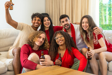 Obraz premium Diverse friends cheering watching a sporting event together