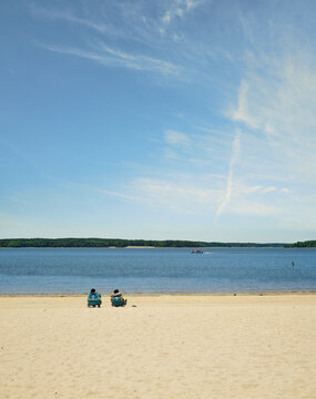 People relaxing on the beach at Falls Lake near Raleigh, North Carolina
