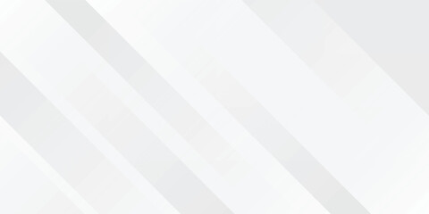 Fototapeta premium Abstract white and grey background with overlapping diagonal geometric stripes. Modern minimalist sleek design featuring bright light silver tones and clean subtle shapes.