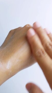 Cleaning hand skin with soap evenly and thoroughly. Hygiene concept for protection from germs and bacteria. Close up view.