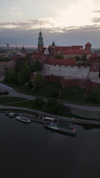 Aerial flyover of Wawel Castle in Krakow at dawn in spring