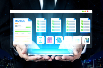 Fototapeta premium A businessman in a suit holds a digital screen displaying invoice and document icons, symbolizing modern financial management and tax compliance in today digital workplace. Ledger
