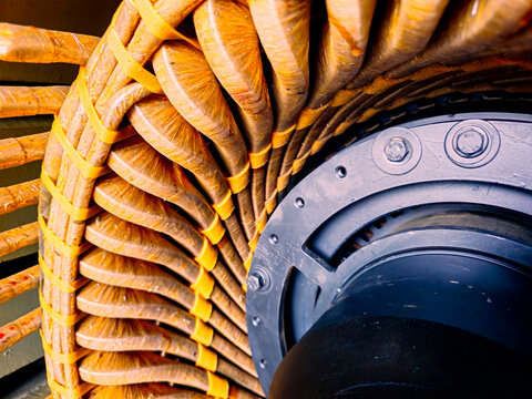 Close-up detail of copper windings inside a large industrial electric motor or generator stator