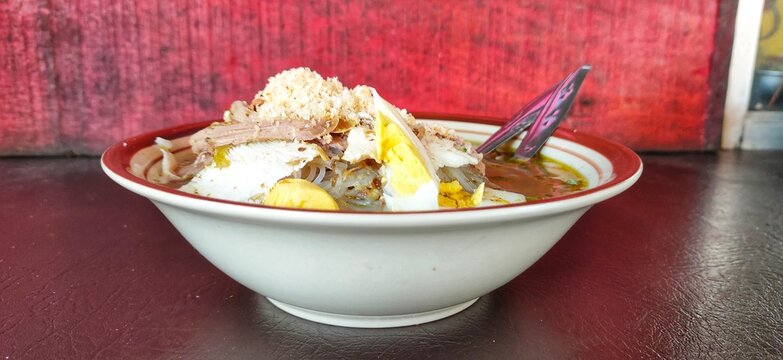 Lamongan soto is a traditional Indonesian soup made from broth, meat, and vegetables, with a distinctive style from the Lamongan region of East Java. A bowl of soto is ready to be enjoyed.