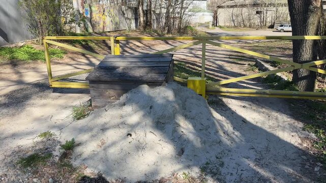 Closing automatic sliding gates of metal frame on dirt road