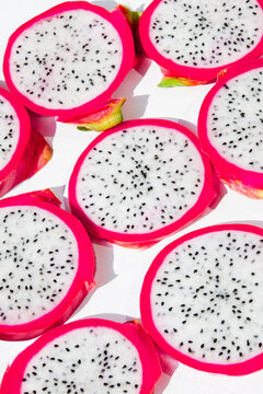 Dragon fruit slices angled white background close up macro