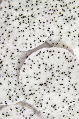Naklejka premium Close Up White Dragon Fruit Flesh Slices on White Background
