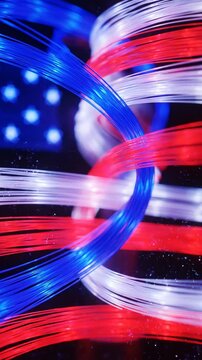 Dynamic Red White and Blue Fiber Optic Lights Swirling in Abstract Formation with Sparkles Fourth of July Celebration