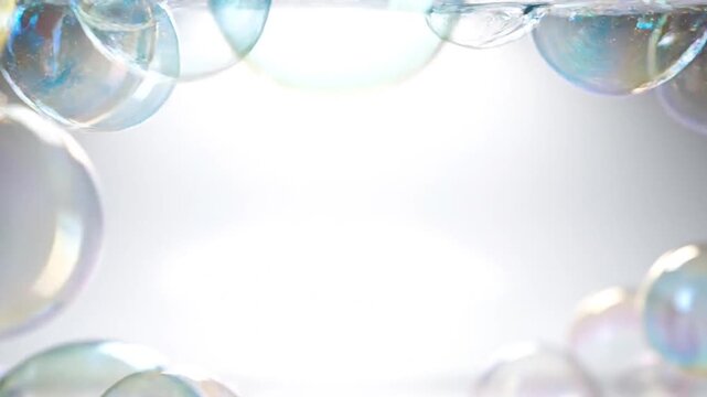 Colorful bubbles floating on a soft light background  