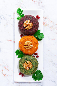 assortment of Phali, three types, pumpkin, spinach and beetroot, Georgian dish, appetizer with nuts and spices, no people, homemade,