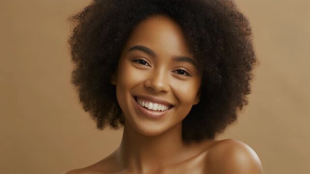 Smiling, dark-haired woman with glowing skin