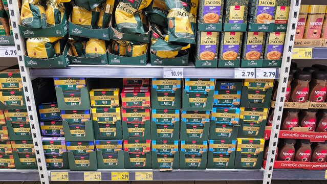 Hagen, Germany &mdash; May 20 2026: packages of Jacobs and Nescafe instant coffee mixes on shelves inside a Kaufland supermarket in Hohenlimburg.