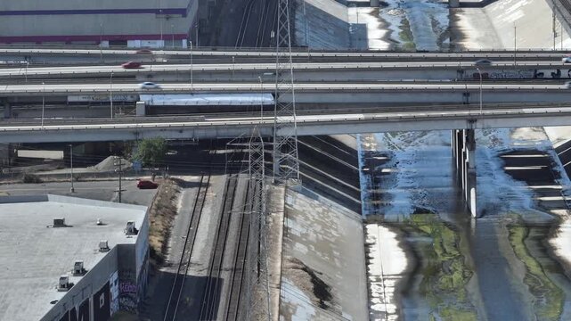 Los Angeles Industrial Close Up River Highway and Tracks Drone Aerial View