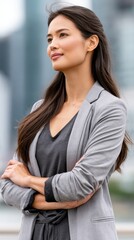Fototapeta premium Confident businesswoman standing with crossed arms in office, professional leadership and corporate success concept.