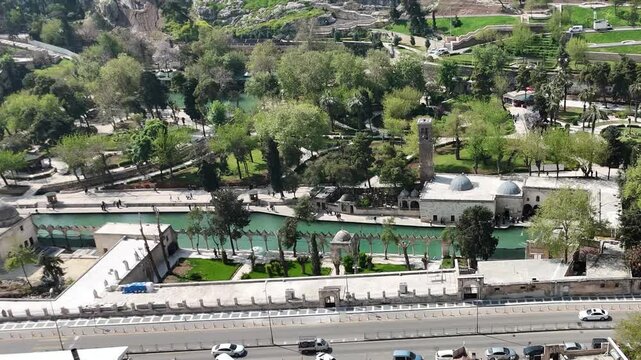 Aerial drone view of Balikligol, the Pool of Sacred Fish and historic mosques in Sanliurfa, Turkey