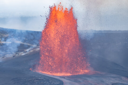 Episode 46 of lava fountaining in Halemaʻumaʻu Crater at the summit of Kīlauea ( shield volcano ). lava fountain and lava flow . Keanakako'i Overlook, Hawaiʻi Volcanoes National Park.