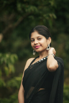 Cinematic Portrait of Indian Girl in Black Saree at Athirappilly Falls