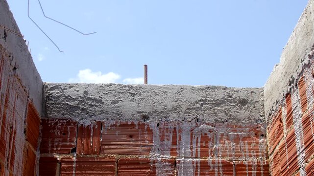 Close-up of clay bricks, authentic building material, revealing the rustic beauty of masonry. Fascinating detail of clay bricks, a timeless choice for enduring and charming buildings.