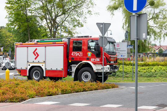 Leba, Poland - August 27, 2025 - Side view of a red Iveco fire engine from the Volunteer Fire Department OSP Leba