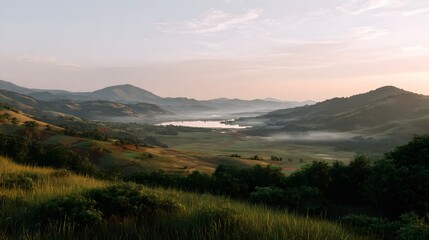 Obraz premium Misty mountain range reflected in calm water during the tranquil morning sunrise