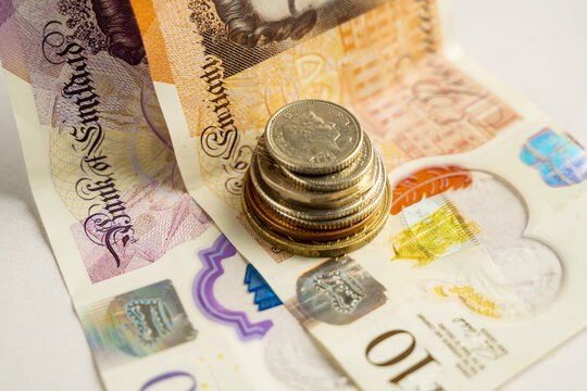 Banknotes and coins close-up, personal finance savings budgeting and cash payment concept