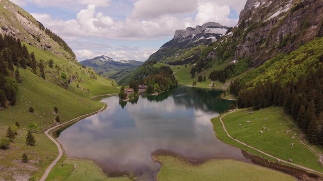 peaceful Aerial Tour of Famous Seealpsee Lake with Snow Capped Santis Background
