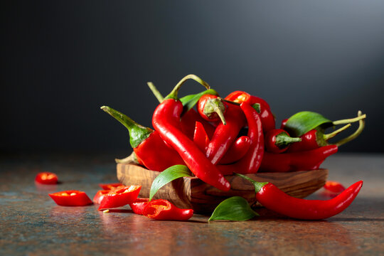 Red hot chili peppers in wooden dish.