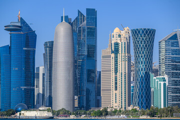 Doha, Qatar, January 3, 2025: The Skyline of Doha time-lapse, captured in the very early morning during sunrise, with the rich, warm colors of the sun reflecting off the glass skyscrapers. © Ali