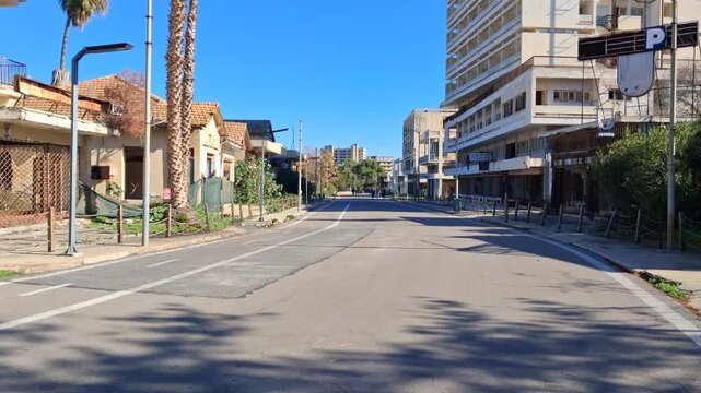 The district of Varosha in Famagusta (Northern Cyprus) was during its heyday, between 1970 and 1974,  one of the most popular tourist destinations in the world. It became a ghost town after the war
