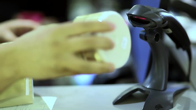 Scanning goods at the checkout. The hands of the cashier in the supermarket. A scanning device at the checkout in the store. 09-10-2025