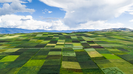 Aerial view of the cultivated fields and mountains of the villages of Cusco, Peru © JuanLuis