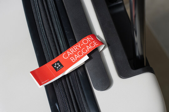 Richmond, BC, Canada - June 13, 2023: Carry-on Baggage tag on a suitcase at Vancouver International Airport.