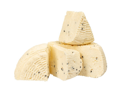 Fresh homemade cheese pieces with black cumin seeds isolated background. Dairy food assortment with soft texture.
