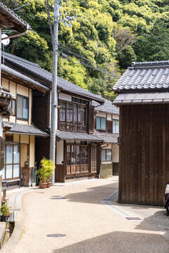 Narrow street of Ine Bay Japan, with traditional wooden homes and buildings in the fishing village