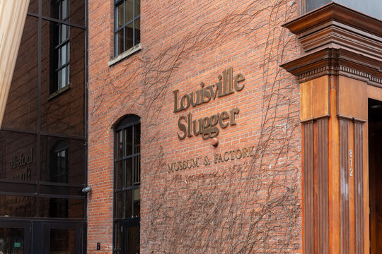 Louisville, KY, USA - December 28, 2021: The signage for Louisville Slugger Museum and Factory on the building in Louisville, KY, USA, a museum and factory tour attraction. 