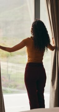 Woman, smile and window with thinking, open and view with curtains, reflection or hotel room on holiday. Person, back and perspective in morning, memory and happy with inspiration at luxury resort