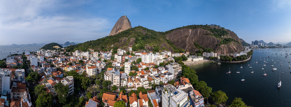Aerial view of Sugarloaf Mountain and the Urca neighborhood with boats anchored in Guanabara Bay, Rio de Janeiro, State of Rio de Janeiro, Brazil.