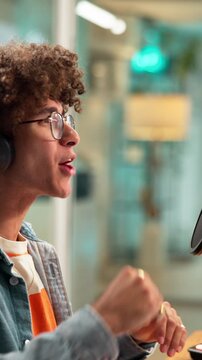 Man, microphone and excited for podcast with discussion, on air recording and audio conversation. Radio presenter, live stream and person with interview in studio for content creation and talk show