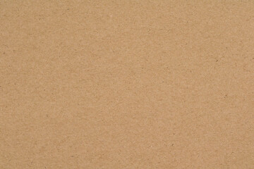 Fototapeta premium Vintage beige paper texture background with subtle grain, speckles, and natural aged surface detail.