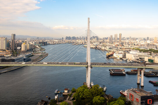 High angle view of Tempozan cable-stayed bridge and Osaka bay harbor skyline from Ferris wheel, Japan