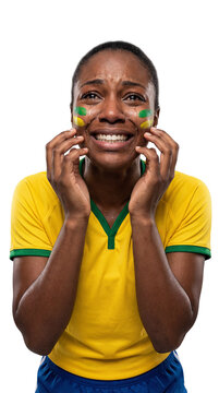 Heartbreak on the Field: A young woman, adorned with face paint in national colors, displays intense sorrow and anguish as she witnesses a devastating sporting event.