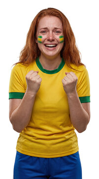 Brazilian Fanatic's Cry: A young woman with vibrant red hair, her face painted in the colors of Brazil, cries out in an outpouring of emotion while watching a sports match.