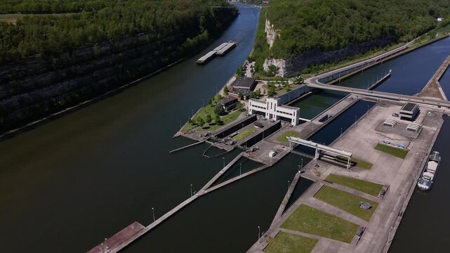 Sailing a barge through the Ecluse de Lanaye on the river Maas between Belgium and the Netherlands