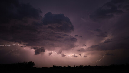 Fototapeta premium Lightning striking during intense night thunderstorm