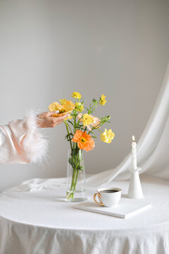 Woman Hand Reaching Spring Flower Vase Candle Coffee Table