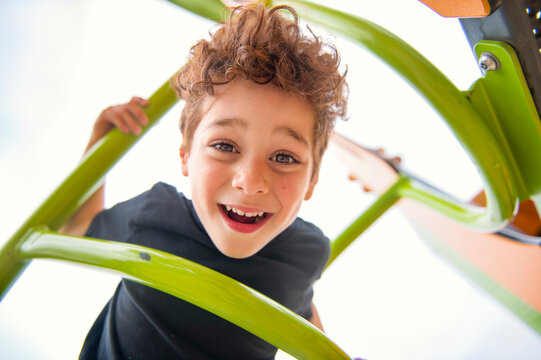 Happy kid on playground on summer season