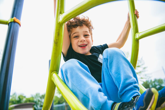 Happy kid on playground on summer season