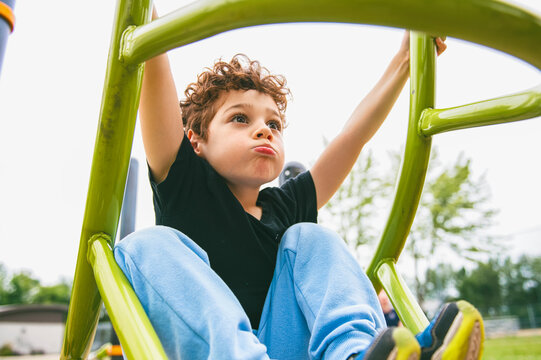 Happy kid on playground on summer season